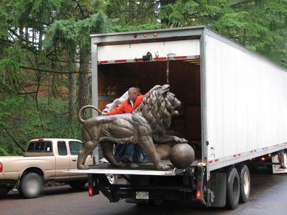 Bronze lion truck delivery