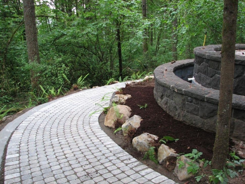 Curved cobblestone path planter