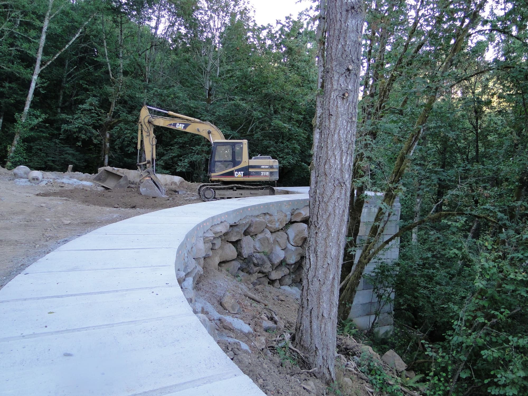 Excavator concrete path construction