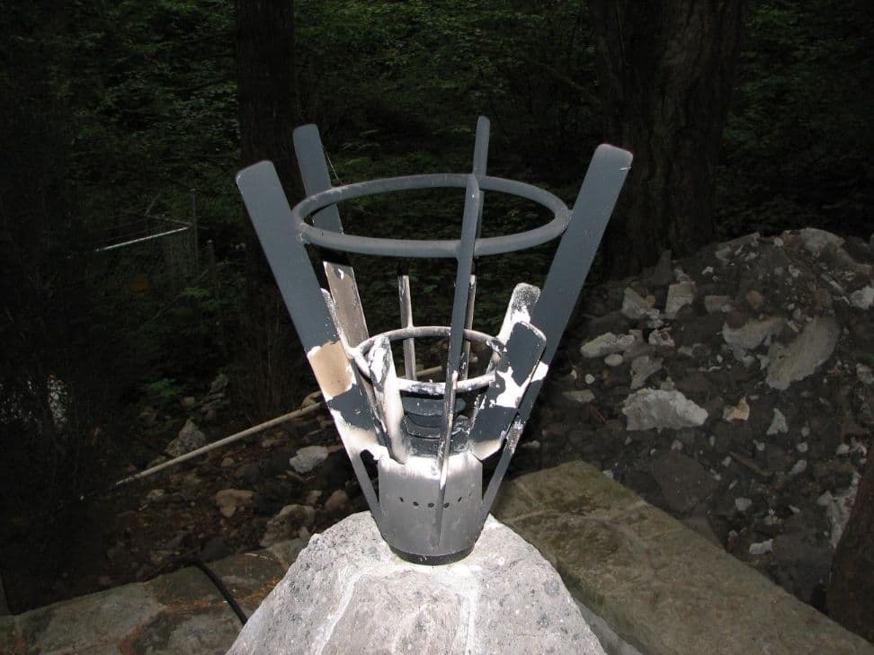 Metal torch fixture stone