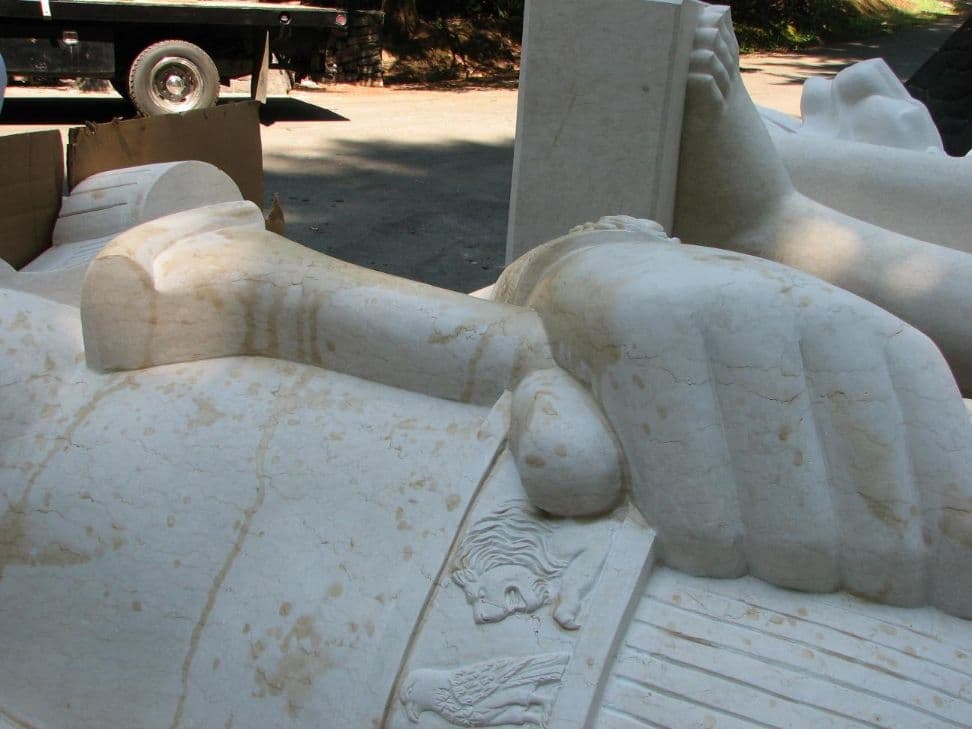 Statue hand scepter closeup