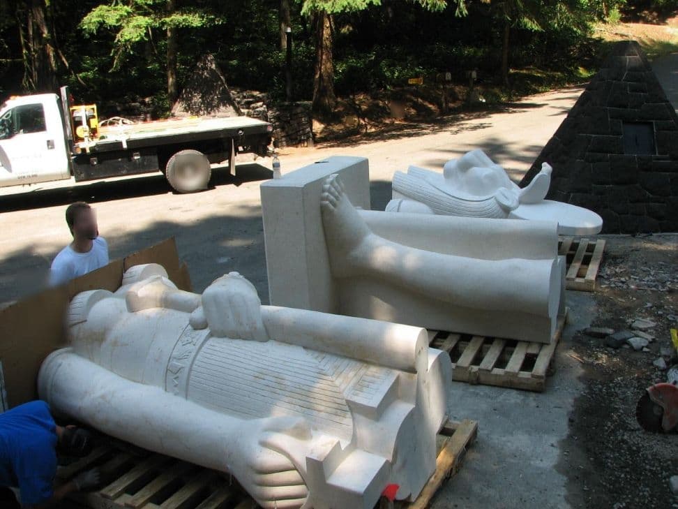 Statue pieces flatbed truck pyramid