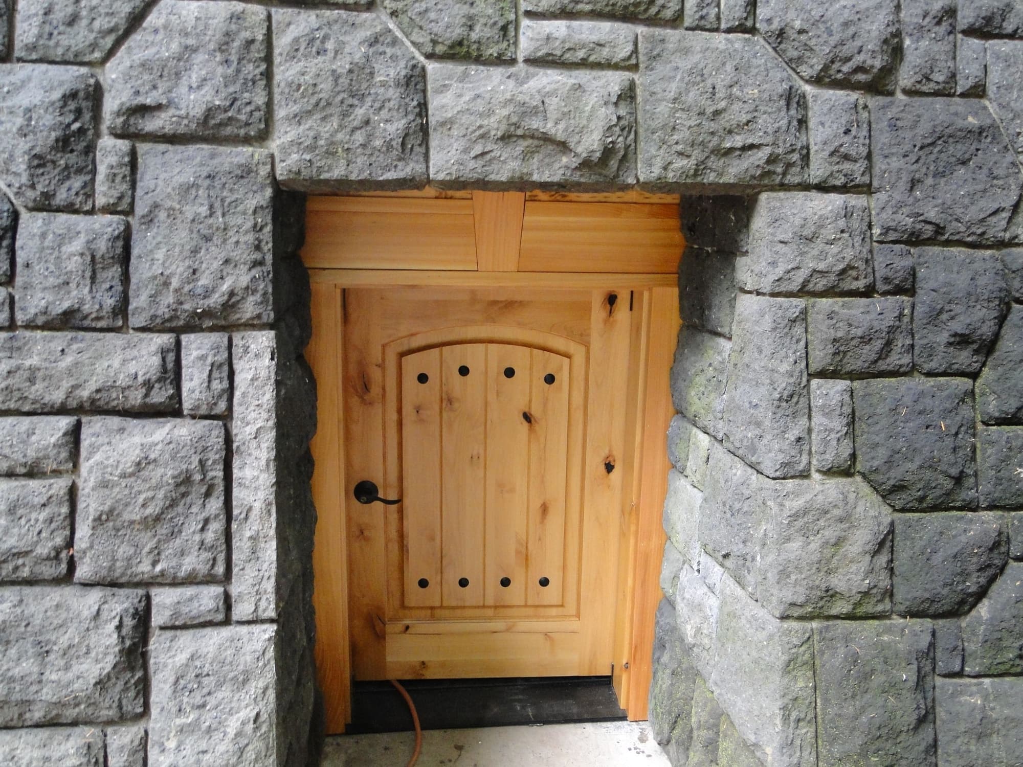 Wooden door stone wall